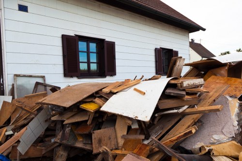 Workers performing builders waste clearance on a construction site